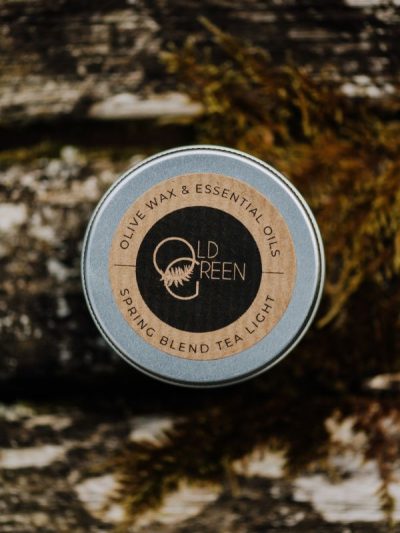 our Spring mint and bergamot candle scent in a reusable tea light tin