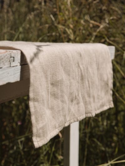 linen table runner on an outdoor table